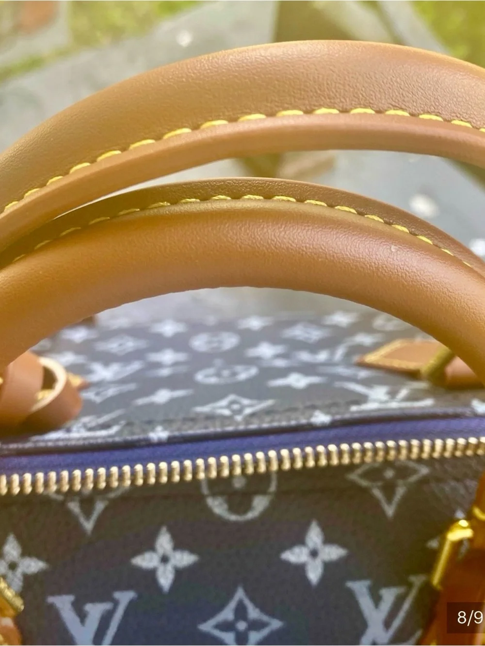 NOT AUTHENTIC Louis Vuitton Navy Monogram Satchel with Brown Leather Trim.